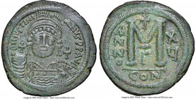 Justinian I the Great (AD 527-565). AE follis or 40 nummi (40mm, 22.35 gm, 6h). NGC AU 5/5 - 3/5, slight bend. Constantinople, 3rd officina, Regnal Ye...