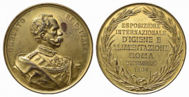 SAVOIA. Umberto I. Medaglia Esposizione Internazionale d'Igiene e Alimentazione Roma 1894. AE dorato (68,13 g - 55,1 mm). Rara qSPL