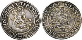 SAINT EMPIRE, Ferdinand Ier (1521-1564), AR Taler, 1554, Joachimstal. D/ B. cour. et cuir. à d., ten. un sceptre sur l''épaule et le pommeau de son ép...