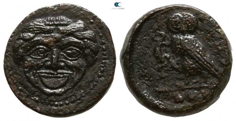 Sicily. Kamarina circa 420-405 BC.
Tetras Æ

13mm., 3,49g.

Facing gorgonei...