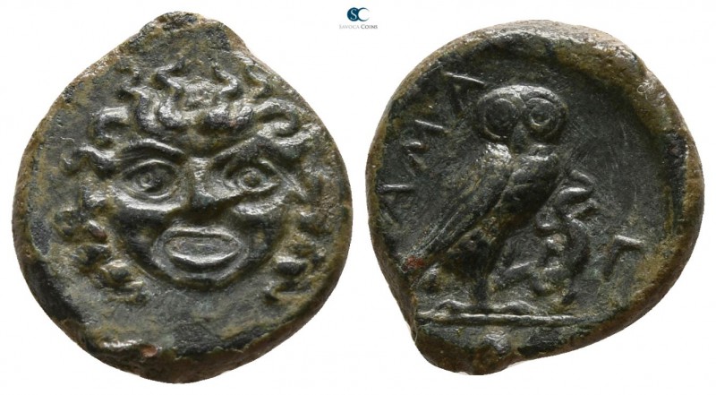 Sicily. Kamarina circa 420-405 BC.
Onkia Æ

13mm., 1,88g.

Head of Gorgonei...