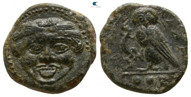 Sicily. Syracuse 420-405 BC.
Tetras Æ

14mm., 2,92g.

Gorgoneion / Owl stan...