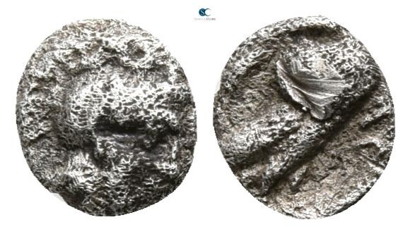 Attica. Athens circa 454-404 BC.
Hemiobol AR

5mm., 0,29g.

Helmeted head o...