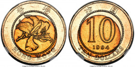 British Colony. Elizabeth II Mint Error - Misaligned Insert 10 Dollars 1994 MS62 NGC, KM70. Displaying a dramatic and visually interesting misaligned ...