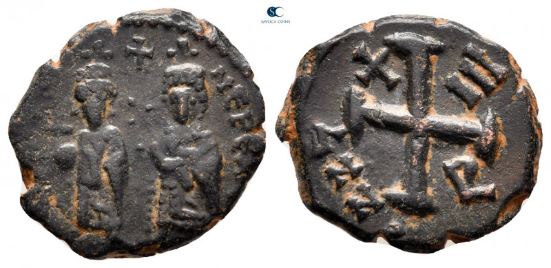 Phocas, with Leontia AD 602-610. Theoupolis (Antioch)
Decanummium Æ

17 mm, 2...