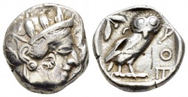 ATTICA. Athens.(Circa 454-404 BC).Tetradrachm.

Obv : Helmeted head of Athena right.

Rev : AΘE.
Owl standing right, head facing; olive sprig and...