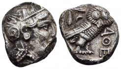 ATTICA. Athens.(Circa 454-404 BC).Tetradrachm.

Obv : Helmeted head of Athena right.

Rev : AΘE.
Owl standing right, head facing; olive sprig and...