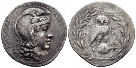 ATTICA.Athens.(Circa 168/5-50 BC).New Style Tetradrachm.

Obv : Helmeted head of Athena to right.

Rev : Owl, with head facing, standing right on ...