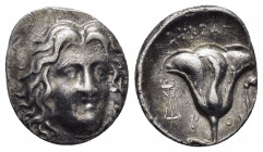 CARIA.Rhodes.(229-205 BC).Drachm.

Obv : Head of Helios facing slightly right.

Rev : EYKPATHΣ / P - O.
Rose, bud to right, tripod to left.
SNG Keckma...