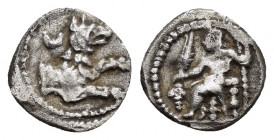 LYCAONIA.Laranda.(Circa 324-323 BC).Obol.

Obv : Baaltars seated left, holding grain ear, bunch of grapes, and scepter.

Rev : Forepart of wolf right;...