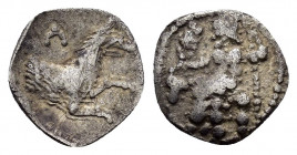 LYCAONIA.Laranda.( Circa 324-323 BC).Obol.

Obv : Λ.
Forepart of a wolf to right.

Rev : Baaltars seated left, holding grain ear, grapes, and sceptre....