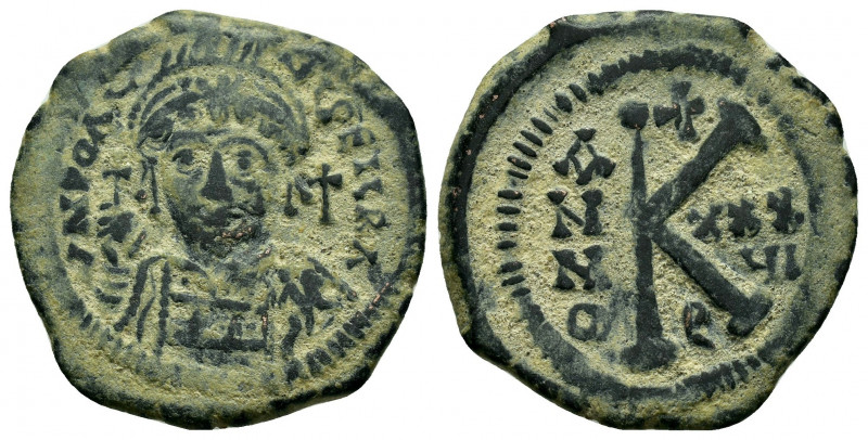 JUSTINIAN I.(527-565).Antioch.Half Follis.

Obv : 
Helmeted, cuirassed bust faci...