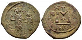 HERACLIUS and HERACLIUS CONSTANTINE.(610-641).Seleucia Isauriae.Follis.

Obv : Heraclius and Heraclius Constantine, each wearing chlamys and crown top...