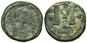 JUSTINIAN I.(527-565).Antioch.Follis. 

Obv : D N IVSTINIANVS PP AV.
Legend with diademed, draped and cuirassed bust right. 

Rev : Large M with star ...