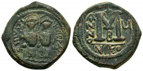 JUSTIN II and SOPHIA.(565-578).Nicomedia.Follis. 

Obv : D N IVSTINVS P P AVG.
Justin II on left, Sophia on right, seated facing on double-throne, bot...