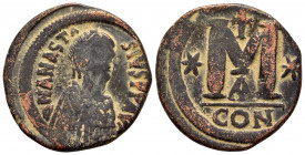 ANASTASIUS I.(491-518).Constantinople.Follis. 

Obv : DN ANASTASIVS PP AVG.
Pearl diademed, draped, cuirassed bust to right.

Rev : Large M, star left...