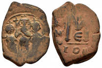 UMAYYAD CALIPHATE.Pseudo Byzantine Type.Imitating the Types of Constans II.(Circa 647-670).Follis.

Obv : Three Standing Figures.

Rev : 

Condition :...