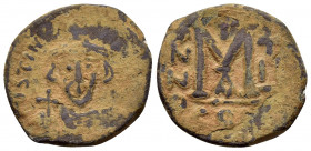 JUSTINIAN II.(First reign 685-695).Constantinople.Follis.

Obv : IVSTINIANVS P.
Crowned bust facing, short beard, wearing chlamys, holding cross on...