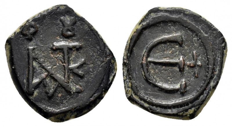 JUSTIN II.(565-578).Constantinople.Decanummium.

Obv : Monogram.

Rev : Large ep...