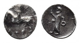 CARIA. Uncertain. Circa 400-334 BC. Hemiobol. 
Obv: Horseman to left, wearing satrapal headdress and raising his right hand in salute. 
Rev. Male figu...