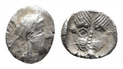 Judaean. Samaria, uncertain mint AR Obol. Circa 375-333 BC. 
Obv: Helmeted head of Athena right.
Rev: Lion's (or panther) head facing. 
Meshorer & Qed...