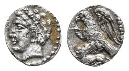 CILICIA. Uncertain. Obol (4th century BC).
Obv: Youthful male head left, wearing grain wreath.
Rev: Eagle, with wings spread, standing left on lion le...