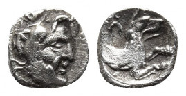 Lykaonia, Laranda AR Obol. Circa 324-323 BC. 
Obv: Head of Herakles to right.
Rev: Forepart of wolf to right; [inverted crescent (or Λ) above]. 
Göktü...