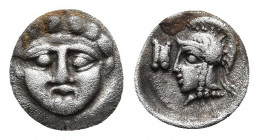 Pisidia, Selge AR Obol. Circa 350-300 BC. 
Obv: Facing gorgoneion with protruding tongue.
Rev: Head of Athena to left, wearing crested Attic helmet; a...