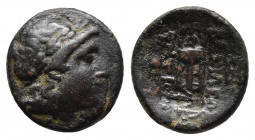 Seleukid Kingdom. Antiochos II Theos. 261-246 B.C. AE. Sardes mint. 
Obv: Laureate head of Apollo right.
Rev: BAΣΙΛΕΩΣ ANTIOXOY, tripod; monograms to ...