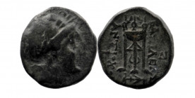 Seleukid Kingdom. Antiochos II Theos. 261-246 B.C. AE. Sardes mint. 
Obv: Laureate head of Apollo right.
Rev: BAΣΙΛΕΩΣ ANTIOXOY, tripod; monograms to ...