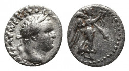 CAPPADOCIA, Caesarea, Titus (79-81) AR hemidrachm. 
Obv: AYKPATωP TITOC KAICAP CEBA - laureate head right 
Rev: Nike advancing right, holding wreath a...