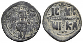 Michael IV the Paphlagonian (1034-1041) AE Nummi Constantinople Bronze.
Obv: Christ Antiphonetes standing facing, holding Gospels. 
Rev: IC-XC/ NI-KA ...