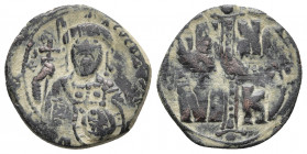Anonymous (attributed to Michael IV). Ca. 1034-1041. AE follis. Anonymous class C. Constantinople mint. Overstruck on an earlier follis.
Obv: +ЄMMANOV...