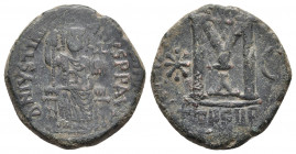 Justinian I AE Follis Theoupolis (Antioch) 546-551 AD. 
Obv: DN IVSTINI-ANVS PP AVG, Justinian seated facing on throne, holding sceptre and cross on g...