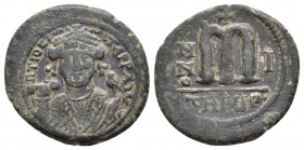 Maurice Tiberius. (582-602) AE Follis Antioch, year 1 = 582/583. 
Obv: INIATIO-NIT PP AIV (sic) - facing bust, wearing crown with trefoil ornament and...