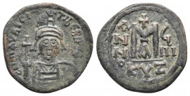 MAURICE TIBERIUS (582-602). Follis. Cyzicus. Dated RY 9 (590/1).
Obv: D N MAVRICI TIЬЄRI P P A. Helmeted and cuirassed bust facing, holding globus cru...