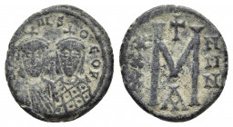 Michael II with Theophilus AD 820-829. Constantinople. Follis Æ.
Obv: MIXA-HL S ΘEOFI, facing busts of Michael, wearing crown and chlamys with short b...