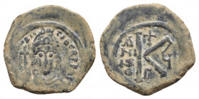 MAURICE TIBERIUS (582-602). Half follis. Constantinople.
Obv: d N mAVR CIT P P AVG. Helmeted and cuirassed bust facing, holding globus cruciger and sh...