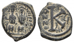 Justin II and Sophia AD 565-578. Dated RY 16=AD 570/1. Nikomedia. Half follis Æ
Obv: D N IVSTI-NVS P P [...], Justin on left, Sophia on right, seated ...