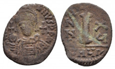 Justinian I. AD 527-565. Theoupolis (Antioch). Decanummium Æ
Obv: Crowned and cuirassed facing bust, holding globus cruciger and shield; cross to righ...