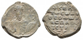 Theodoros, 11th century. Seal Lead.
Obv: Θ / Θ/Є-Δ/O/P Nimbate facing bust of Saint Theodore, holding a spear over his right shoulder, and resting a s...