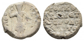 11th century. Seal Lead.
Obv: Θ / Θ/Є-Δ/O/P Nimbate facing bust of Saint Theodore, holding a spear over his right shoulder, and resting a shield on hi...
