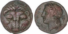 AE 20. 351-280 a.C. BRUTTIUM. RHEGION. Anv.: Piel de león de frente. Rev.: Cabeza de Apolo, detrás ánfora. 8,65 grs. AE. HN Italy-2534b. EBC-.