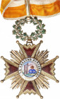 Orden de Isabel La Católica. Cruz de Comendador. (1847, 1868 y 1875-1931). Metal dorado y esmaltes. Ø 56 mm. Con láurea articulada, anilla y cinta de ...