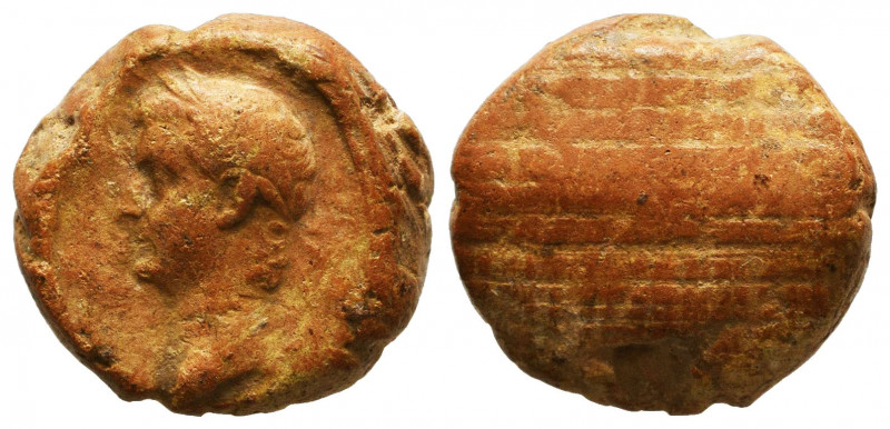 Clay tessera or theater token with the head of Tiberius (14-37 AD). AE

Refere...