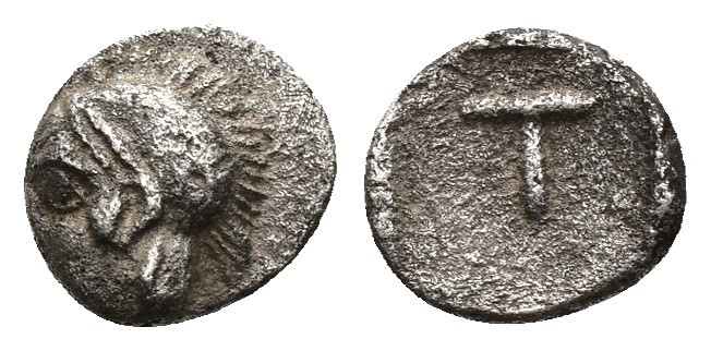 ( Silver.0.26 g. 8 mm) Arkadia, Tegea AR Tetartemorion. c. 423-400. 
Helmeted h...