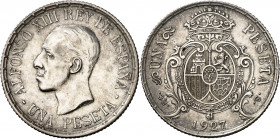 1927. Alfonso XIII. PCS. 1 peseta. (AC. 75, mismo ejemplar). Prueba no adoptada en plata. Firmado: E. VAQUER. Bella. Rarísima. 4,96 g. S/C-.