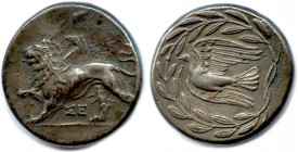 Greek
PÉLOPONNÈSE - SICYONE 400-300
Chimère marchant à gauche. et couronne de laurier. 
R/. Colombe volant à gauche dans une couronne d’olivier.
T...