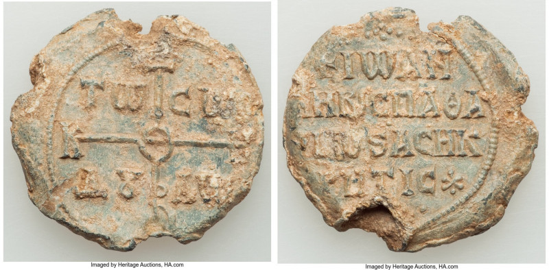 Byzantine. Ca. AD 8th-9th centuries. Lead seal (31mm, 19.00 gm, 12h). XF. Crucif...