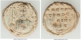 Byzantine. Ca. AD 9th century. Lead seal (22mm, 7.91 gm, 11h). VF. Greek legend, Nimbate figure facing, draped, cross in right hand / Greek inscriptio...